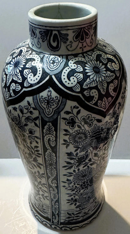Antique blue and white ceramic vase with intricate floral and geometric patterns, cylindrical body with decorative neck rim, 
