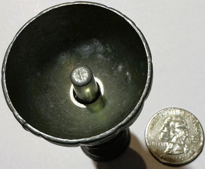 Vintage pewter goblet viewed from above showing fluted bowl and central stem knob, with quarter coin beside for scale