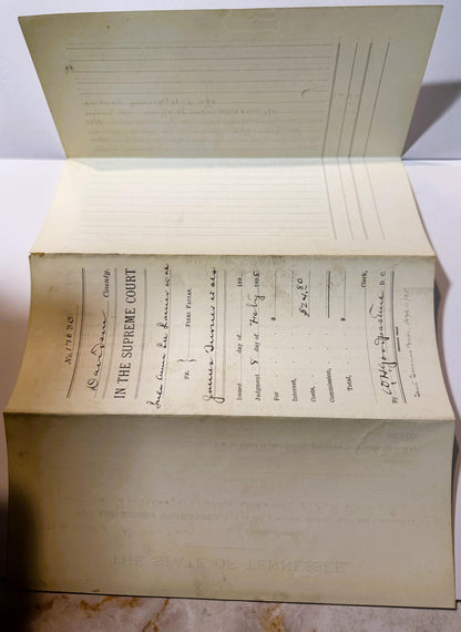 Opened antique legal document from Tennessee Supreme Court with handwritten text and signatures, yellowed pages visible from 