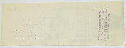 Back of vintage bank check from Butte, Montana jeweler with embossed circles forming numbers, postage stamp visible in upper 