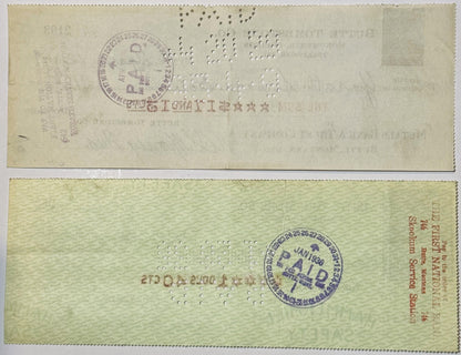 Front and back of a vintage bank check from Butte Tombstone Company with purple circular stamps and perforated holes, on crea