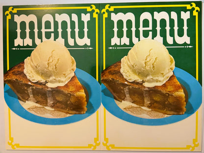Two Weiller ice cream menu covers side by side: white menu lettering on green over a slice of apple pie with a scoop of vanilla ice cream on a turquoise-rimmed plate, yellow scroll border
