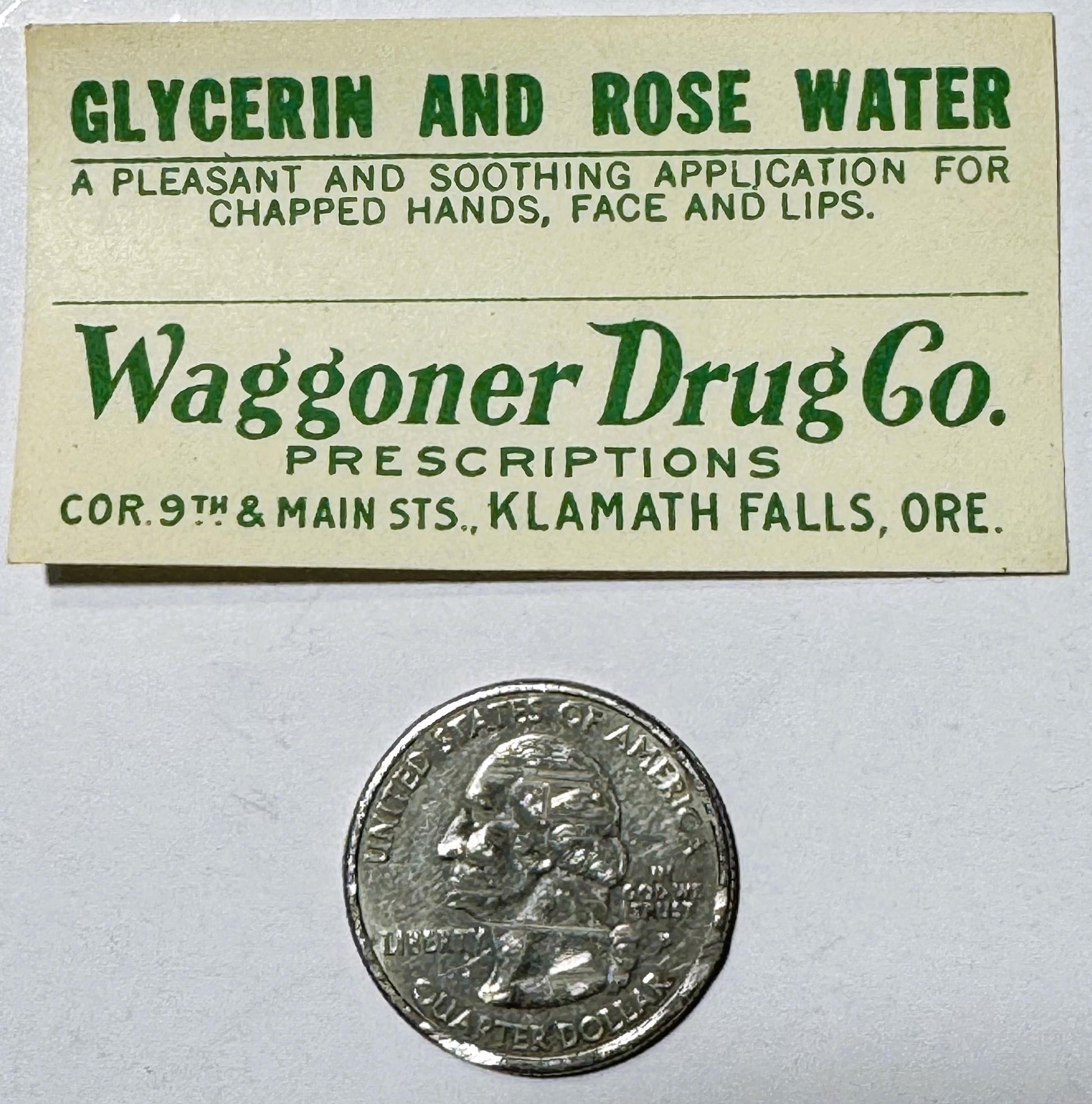 Vintage cream-colored label for glycerin and rose water from Waggoner Drug Co., Klamath Falls, Oregon, shown with a quarter c