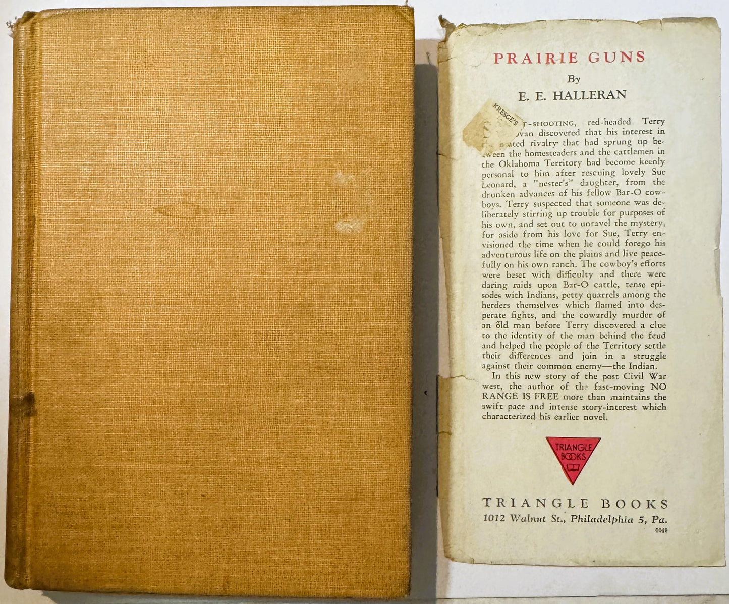 Open hardcover book with tan cloth cover and cream title page reading "Prairie Guns" by E.E. Halleran, published by Triangle 