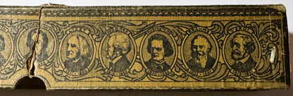 Ornate brass player piano roll header showing six portrait medallions of men in period dress with decorative scrollwork