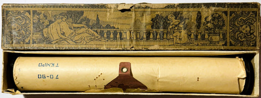 Vintage player piano roll in decorative box with classical illustration on lid; cream-colored roll labeled "Black Hawk Waltz"