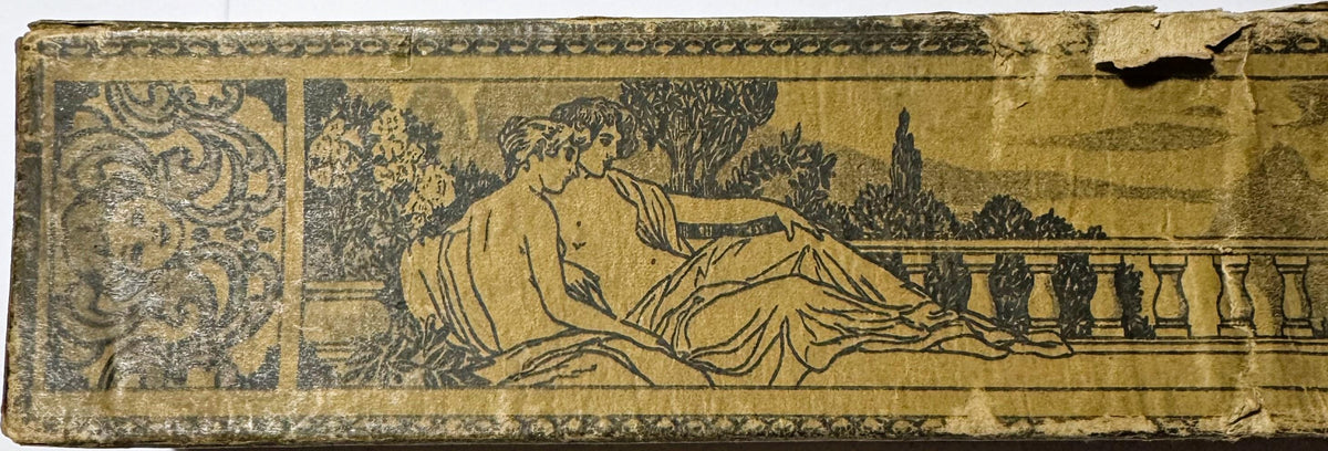 Aged piano roll with ornate decorative border and classical illustration of a reclining woman in flowing robes overlooking a 