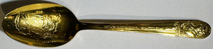 Close view of the Jefferson spoon bowl showing the gold-wash silverplate surface and relief detail.
