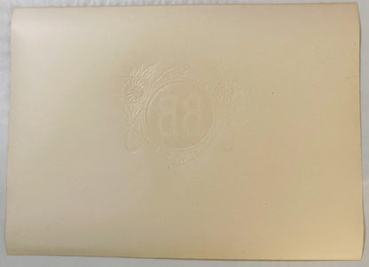Back of the BB cigar label: plain cream paper with the BB monogram, flowers and leaves embossed through in reverse.