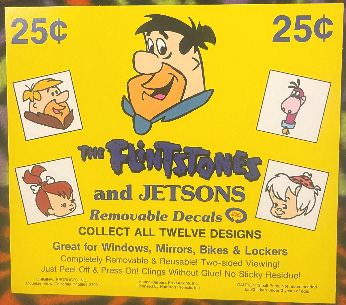 Vintage yellow vending machine sign for Flintstones and Jetsons removable decals priced at 25¢, featuring cartoon characters 