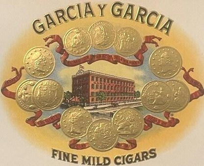 Antique cigar box label with "Garcia Y Garcia Fine Mild Cigars" text, factory building illustration, and gold coins arranged 