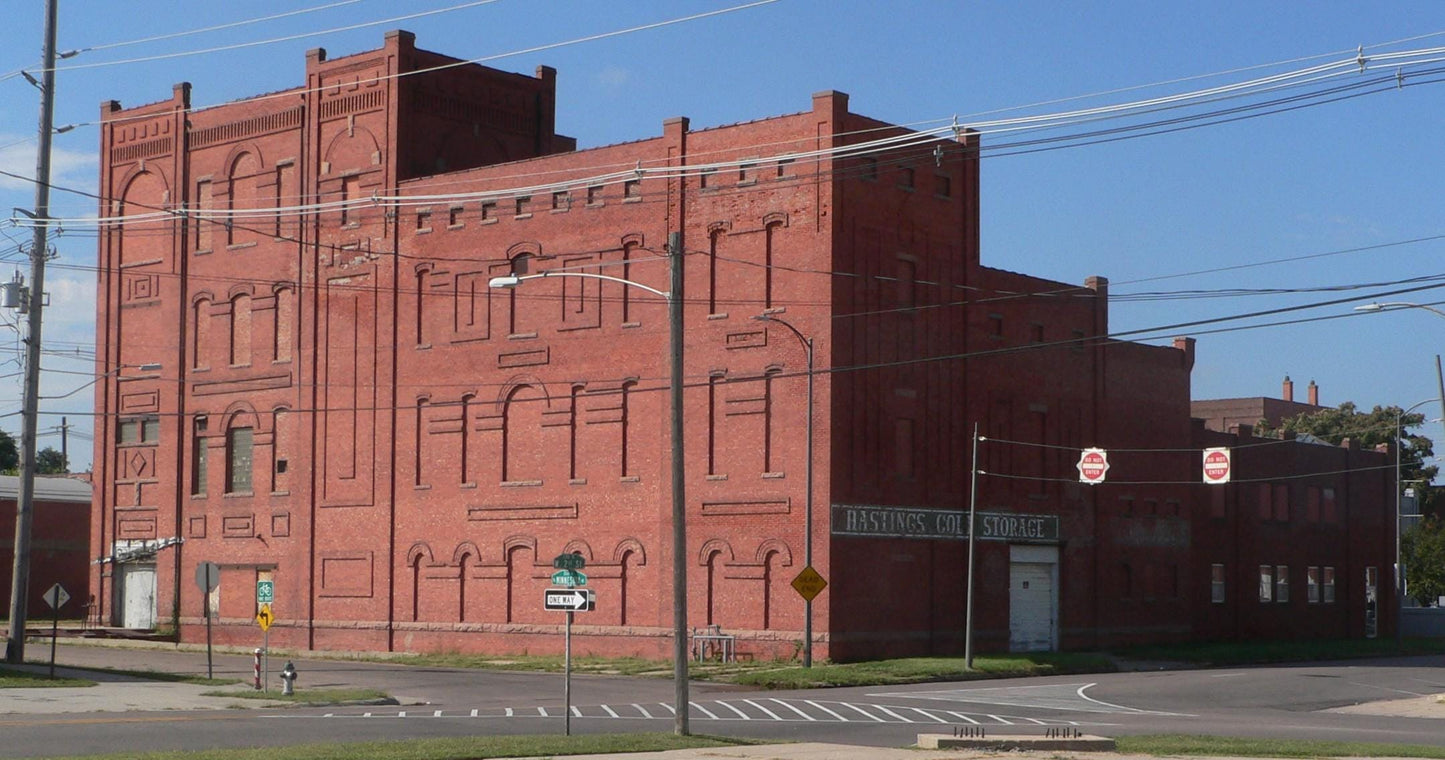 Historic red brick meat packing building in Hastings, Nebraska with "Hastings Col. Storage" signage visible on facade