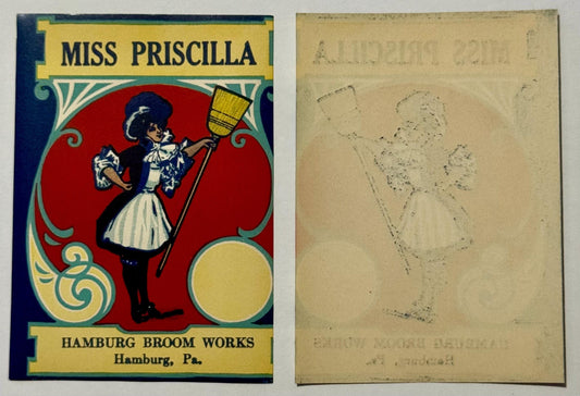 Vintage broom label featuring stylized woman in blue dress holding broom against red circular background.