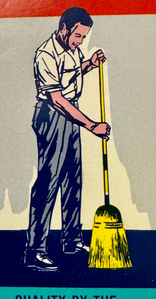 Man in light shirt sweeping with yellow broom on red, white, and blue striped background.