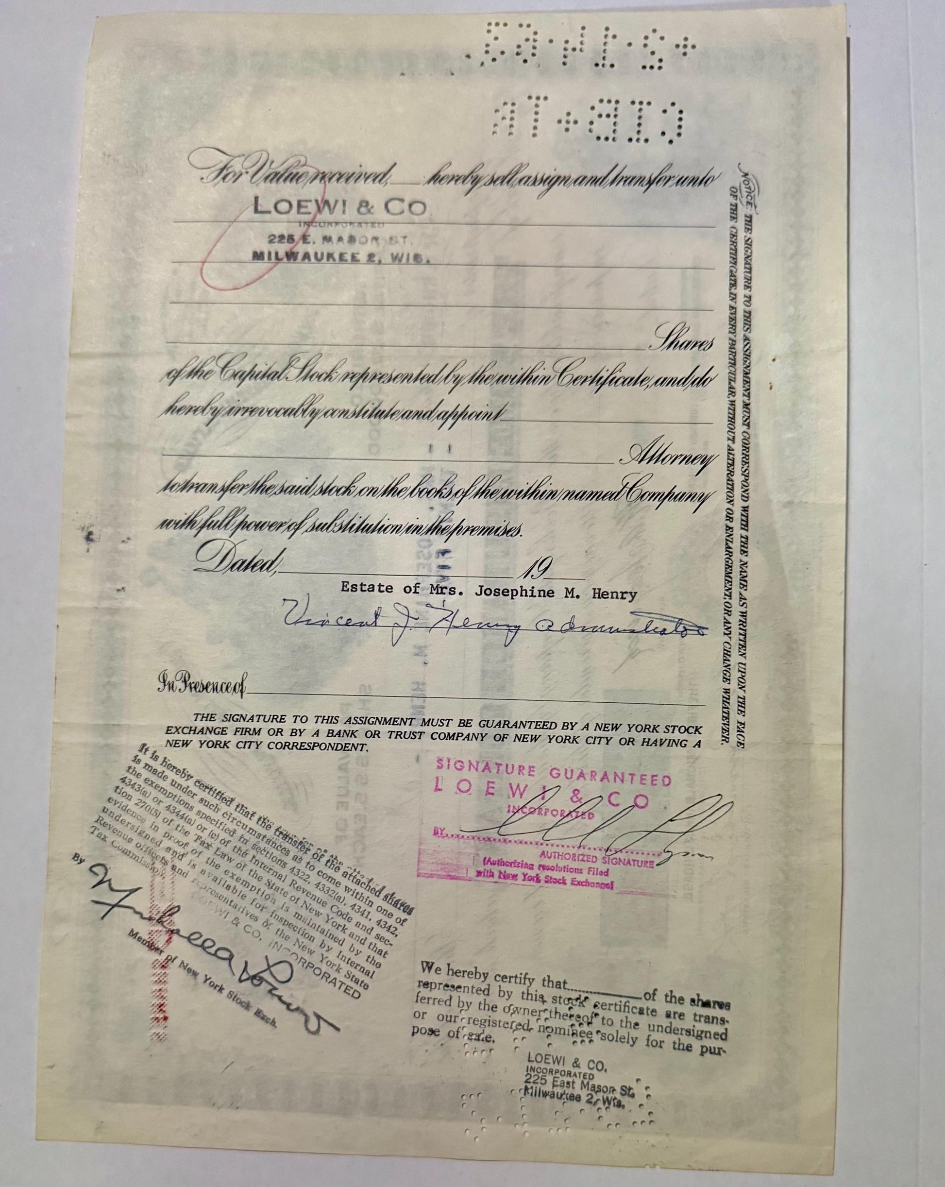 Aged stock certificate from Loewy & Co, Milwaukee, with handwritten signatures, red stamp marks, and braille dots visible at 