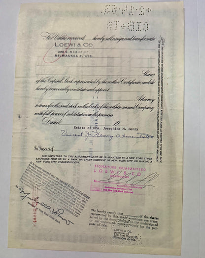 Aged stock certificate from Loewy & Co, Milwaukee, with handwritten signatures, red stamp marks, and braille dots visible at 