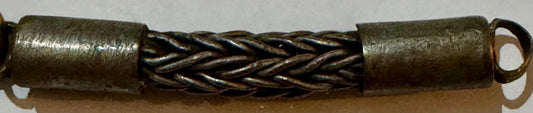 Antique brass foxtail chain with looped cylindrical ends and twisted braided metal center section.