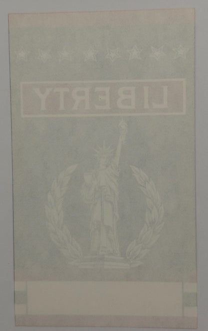Antique broom label with faded Statue of Liberty image and "LIBERTY" text in embossed lettering on cream-colored paper