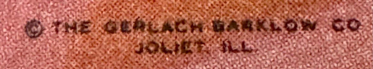 Close-up of embossed text on pink textured surface reading "THE CHURCHILL BRAND" and "CIGARETTES
