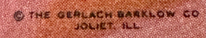 Close-up of embossed text on pink textured surface reading "THE CHURCHILL BRAND" and "CIGARETTES
