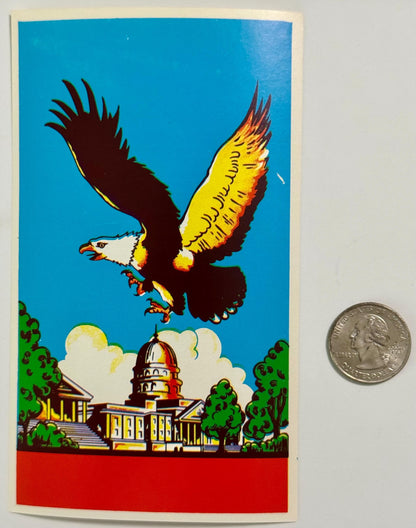 Vintage broom label featuring bald eagle in flight over Capitol building with quarter coin for scale