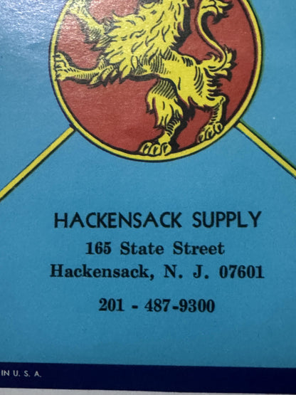 Lower half of the label: the lion's red disc and HACKENSACK SUPPLY over its Hackensack, N. J. address and phone line