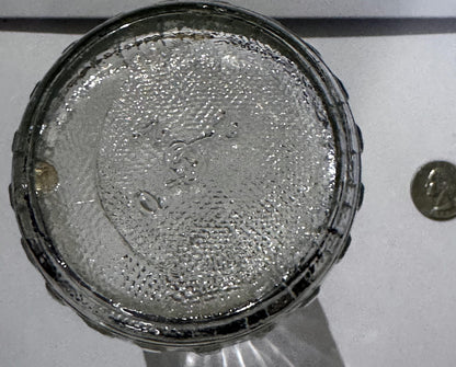 Stippled glass base of the Nyseptol bottle with its embossed mark