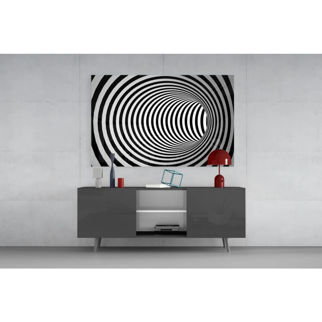Bold black and white hypnotic spiral tunnel wall art above gray console table