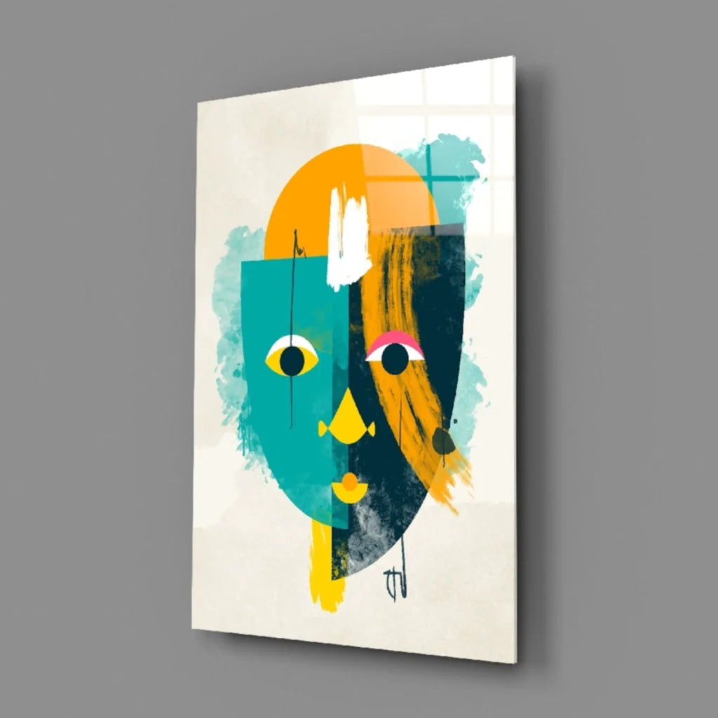 Bold geometric face glass wall art in teal orange with yellow eyes