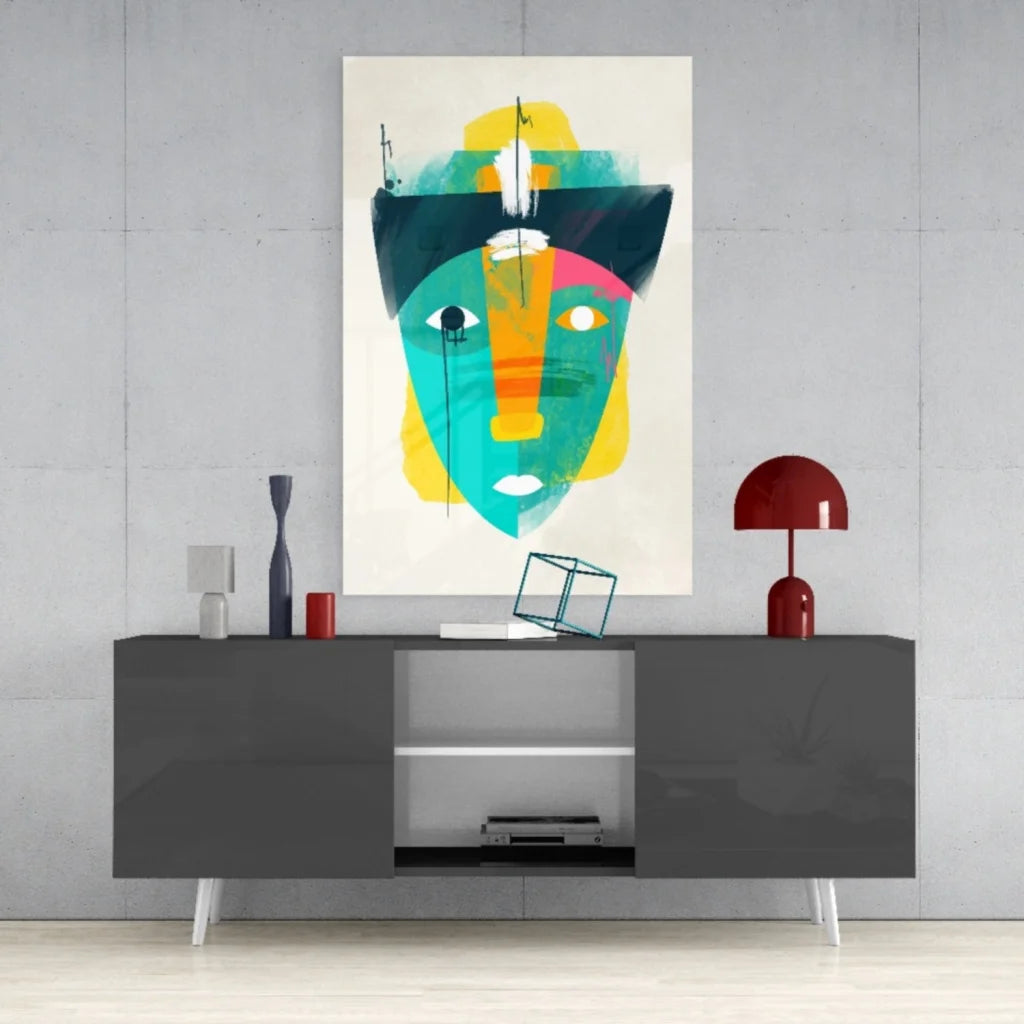 Vibrant abstract face in glass wall art with teal, yellow, pink shapes
