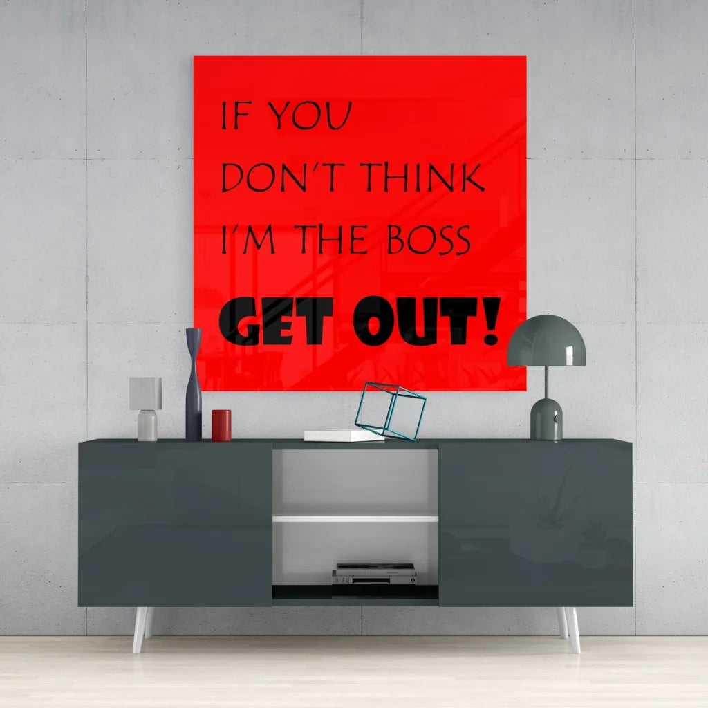 Vibrant red tempered glass art with bold boss statement above gray console