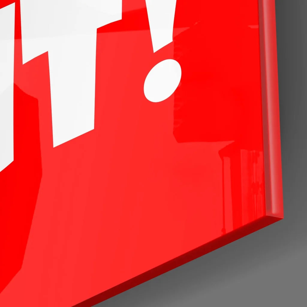 Vibrant red tempered glass art with bold white exclamation mark