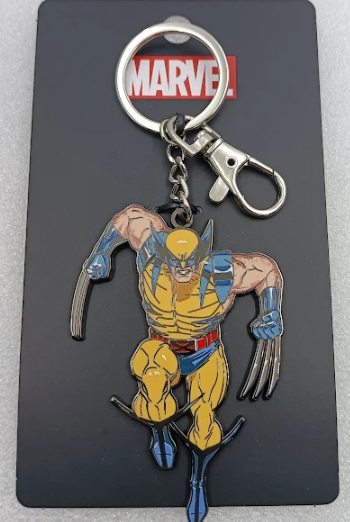 Front view of a Wolverine keychain with yellow and blue enamel, silver claws and key ring, on a black Marvel card.