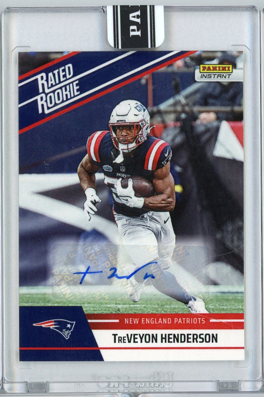 Front of graded football card showing TreVeyon Henderson in New England Patriots uniform with blue autograph, enclosed in clear protective case.