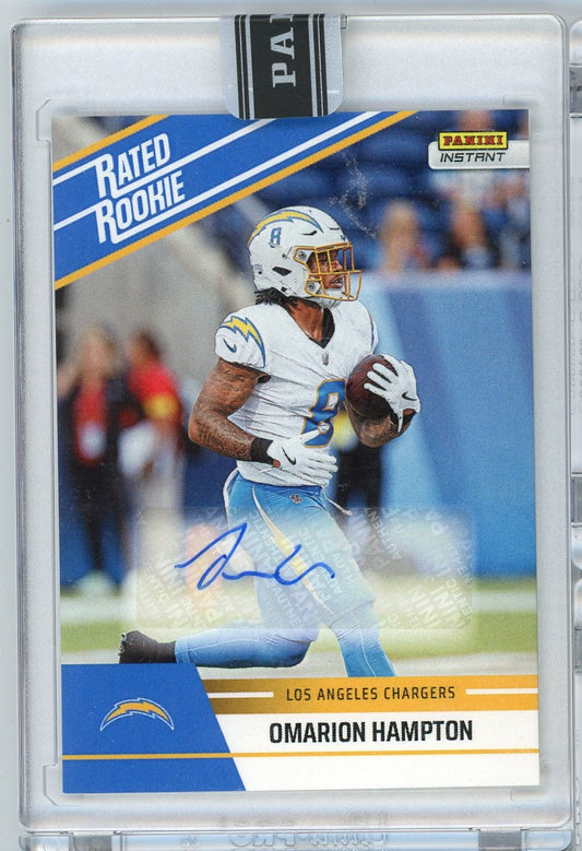 Signed football card featuring Omarion Hampton in white Los Angeles Chargers uniform holding football, with blue diagonal design and printed autograph.
