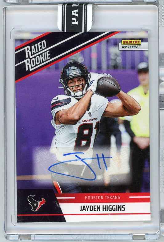Front of autographed football card showing Jayden Higgins in white Houston Texans uniform catching football, with blue signature and "Rated Rookie" banner.