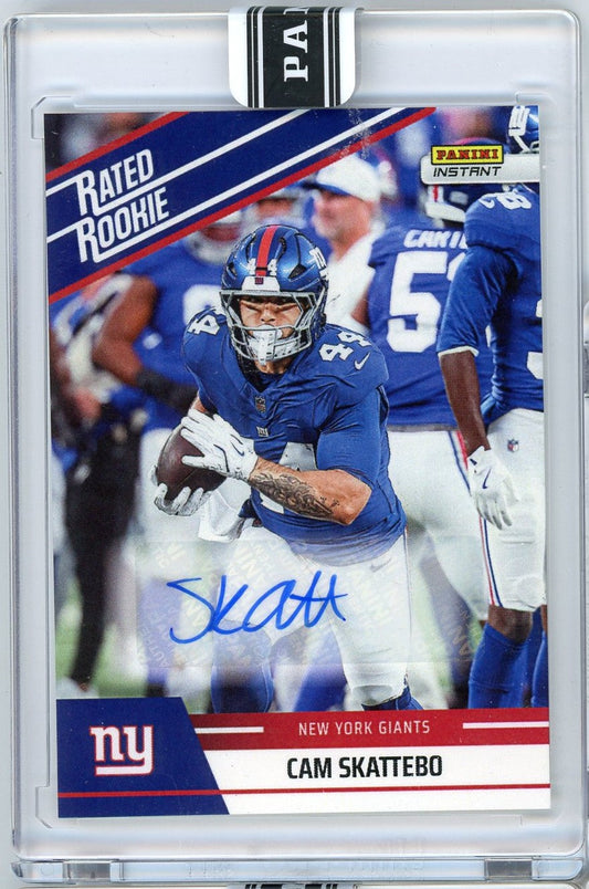 Graded sports trading card showing New York Giants running back Cam Skattebo in blue uniform with autograph, encased in clear plastic holder with black grading label.