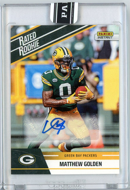 Front of graded football card showing Green Bay Packers receiver Matthew Golden in yellow and green uniform holding football, with blue autograph and card details below.