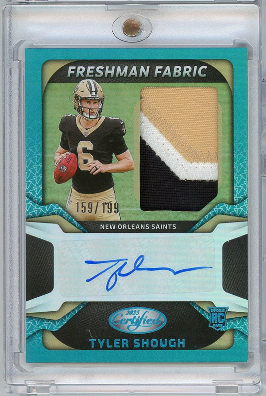 Front of turquoise football card featuring New Orleans Saints player Tyler Shough in black jersey, fabric swatch, and blue autograph, numbered 159/199.