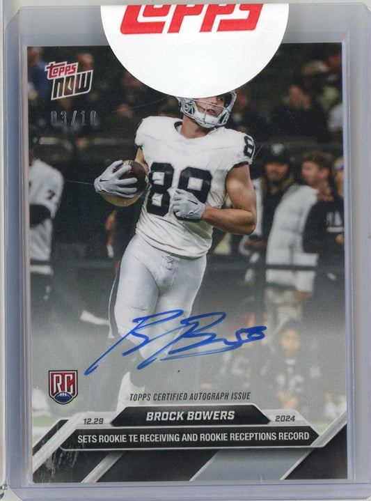 Signed 2024 Topps Now Brock Bowers rookie card showing player in white Raiders uniform catching football, numbered 09/10.