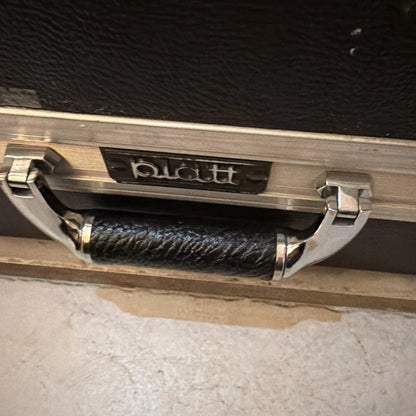 Black leather handle with silver hardware on Platt machine vision camera control unit