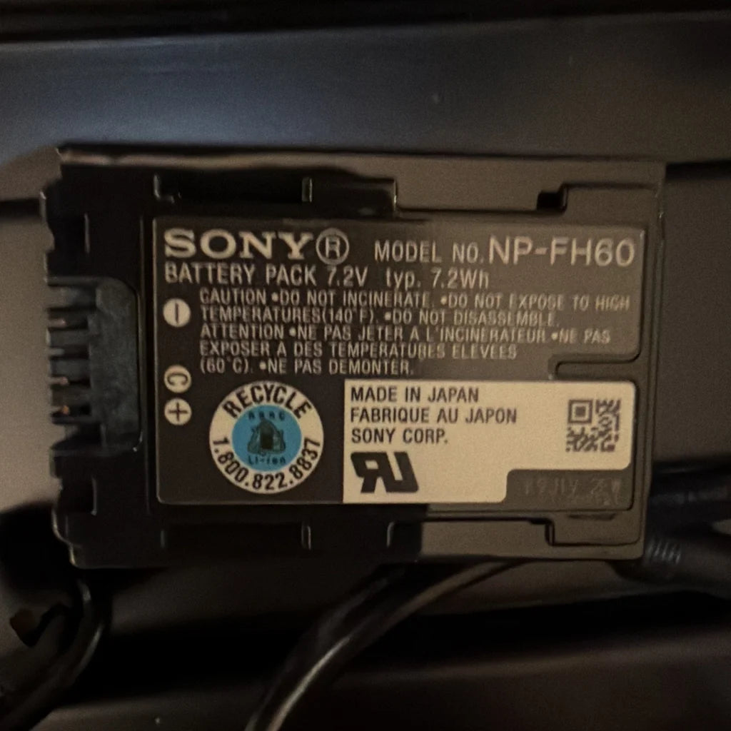 Black Sony NP-FH60 battery in machine vision camera control unit case