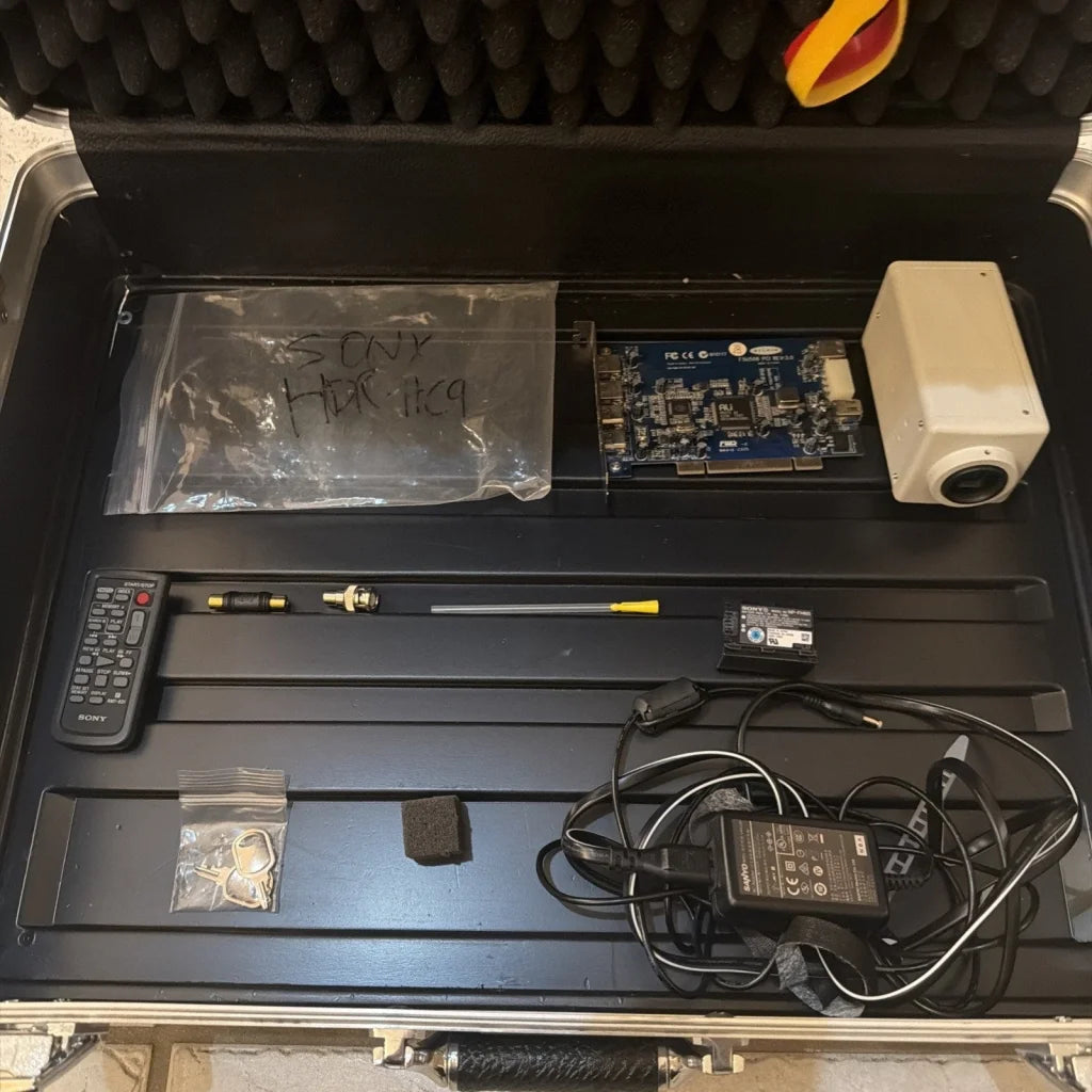 Black Sony HDR-HC9 machine vision camera control unit with blue circuit board