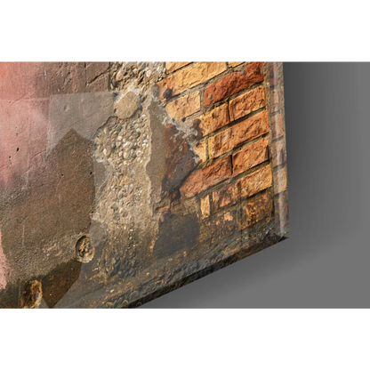 Banksy style wall art canvas of weathered brick wall with pink spray paint