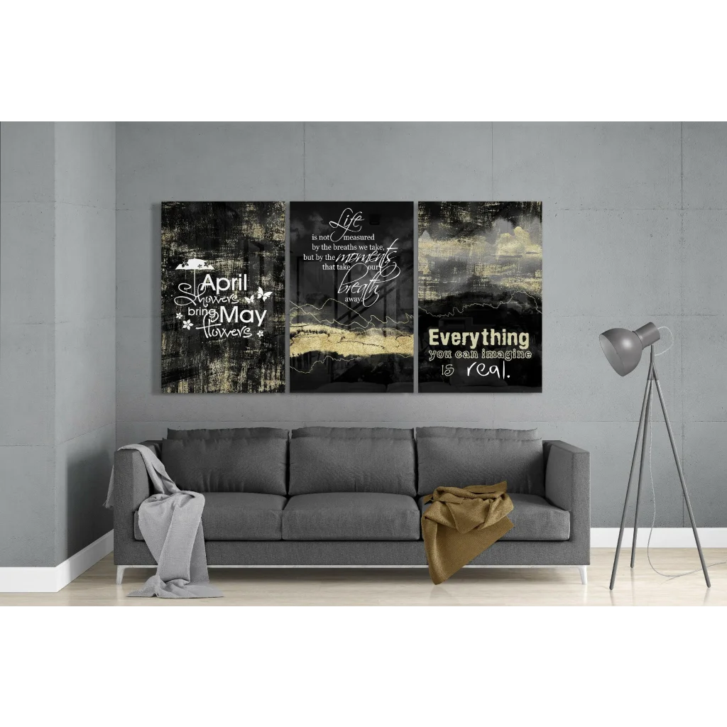 Black gold abstract glass wall art triptych with quotes above sofa