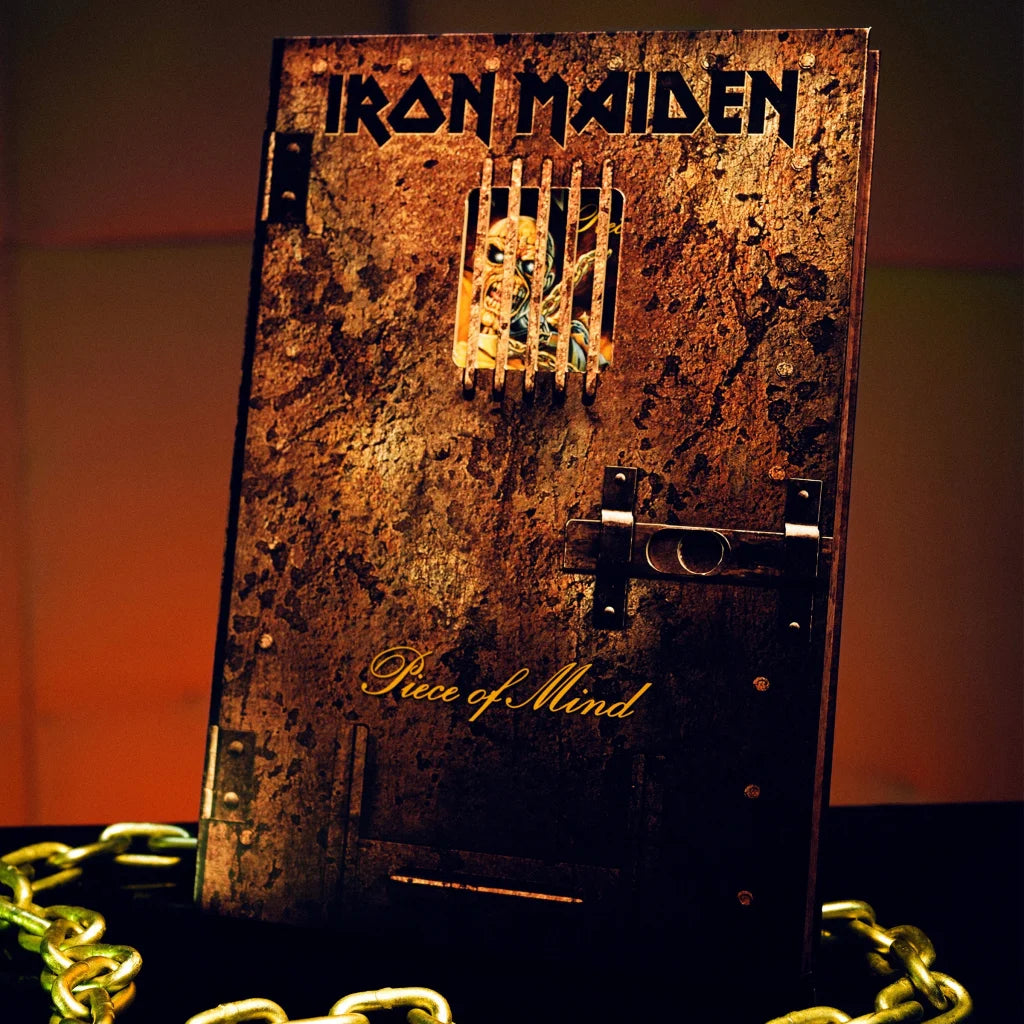 Iron Maiden Rantz Hoseley album with rusty barred door and monstrous face design