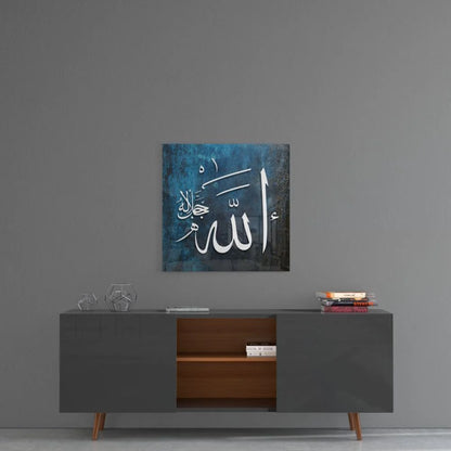 Blue tempered glass art with Arabic calligraphy above gray sideboard