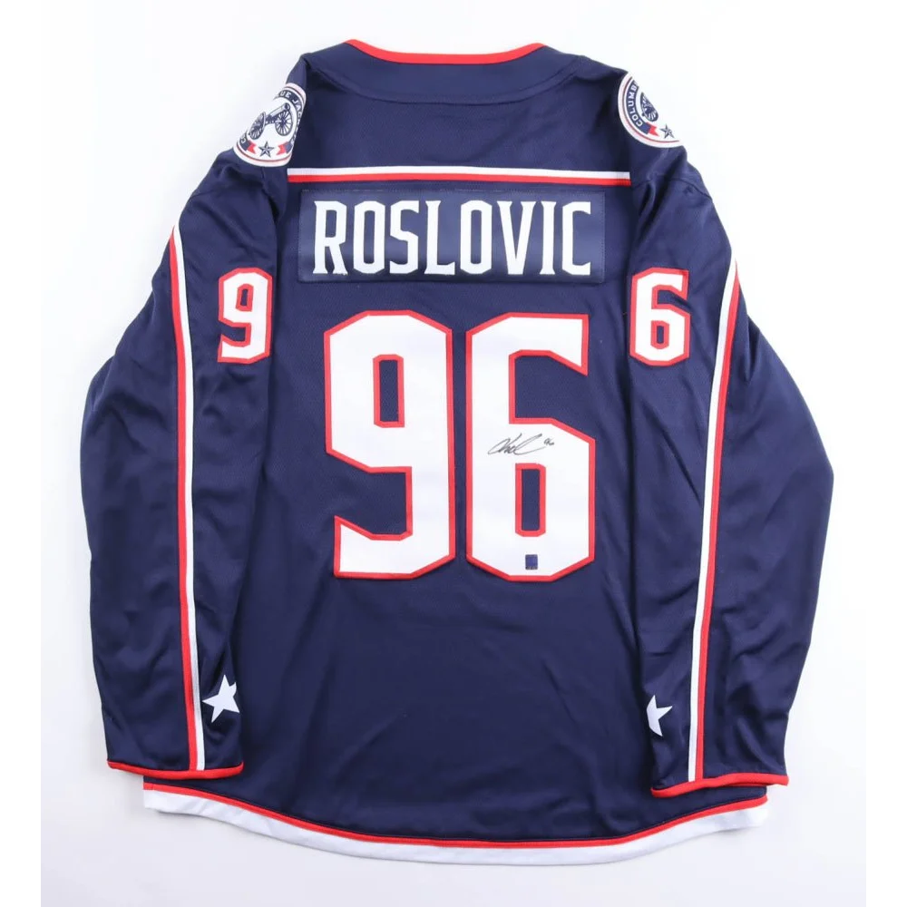 Autographed Jack Roslovic Blue Jackets navy blue jersey with red and white accents