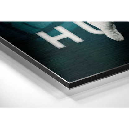 Dark teal brushed aluminium dibond print with white lettering and astronaut boot