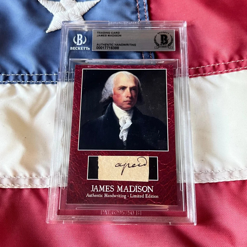 A maroon textured james madison authentic handwritten autograph trading card encased in a clear beckett slab